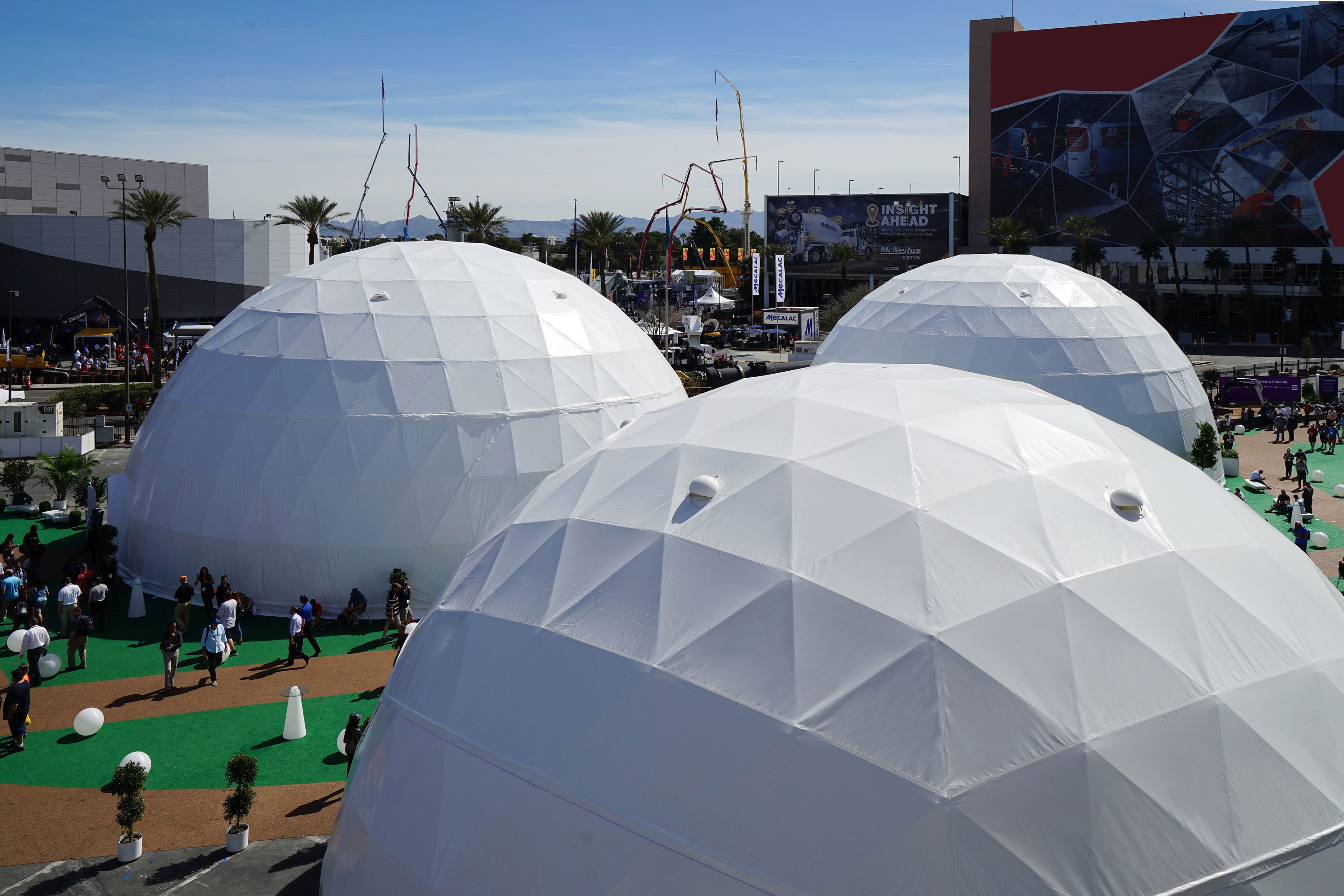 Alt text: &quot;Large white geodesic domes at an outdoor event, showcasing premium glamping solutions. These structures are ideal for luxury Airbnb stays, sustainable living, and creative spaces. Keywords: geodesic dome house, glamping pods, dome home, outdoor dome.&quot;