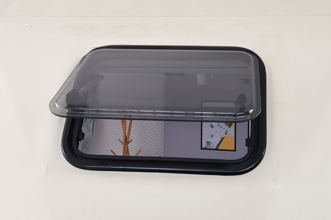 Alt text: "Open porthole window in a stylish geodesic dome, showcasing the interior design of a luxury glamping pod. Ideal for sustainable living, backyard offices, or art studios. Explore our range of geodesic dome house kits and glamping solutions."